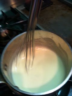 the whisk is being stirred in a pan on the stove