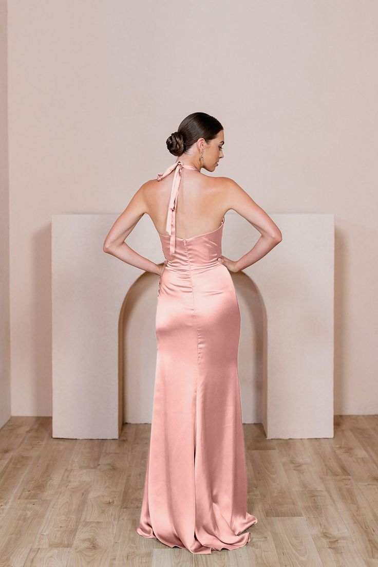 Enhance your bridal party with this modern and fitted version of a halter dress that will keep everyone looking! Our Fallon Satin dress features a halter neck that ties in the back with thick satin straps leaving your back open and is then finished with a delicate gathering at the waist on the left side of this dress to provide extra tummy coverage. Fallon pairs well with our Rory, Jade, and Dawson dresses. FEATURES: Fitted silhouette Halter top neckline Built-in bra cups and vertical boning for Revelry Bridesmaid Dresses, Revelry Bridesmaid, Revelry Dresses, Satin Halter Dress, Wedding Parties Colors, Top Neckline, Dress Bridesmaids, Bridesmaid Dress Colors, Bridesmaids Dress