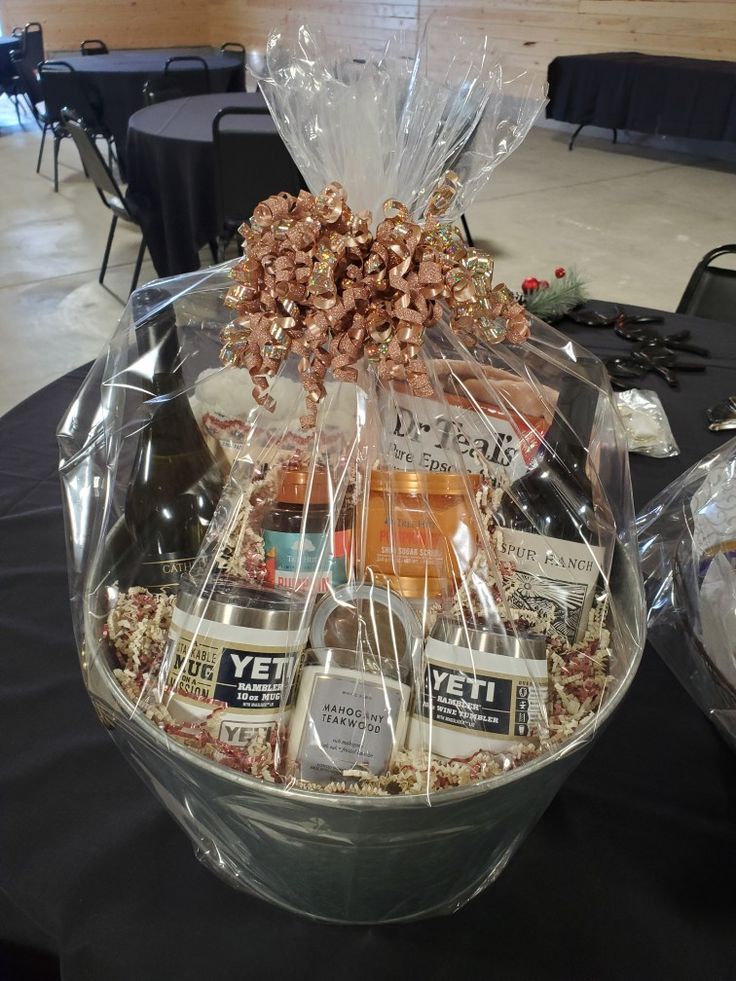 a large basket filled with liquor bottles and snacks