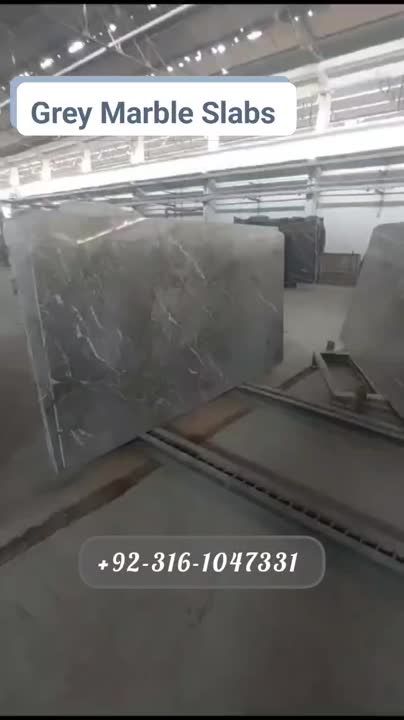 there are many marble slabs in the warehouse