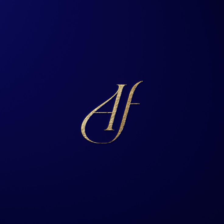 the letter j is made up of gold foil on a dark blue background with an elegant design