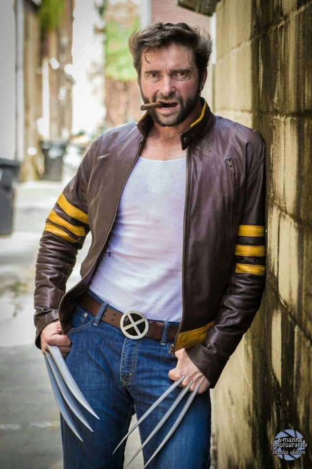 a man in a leather jacket and wolverine costume