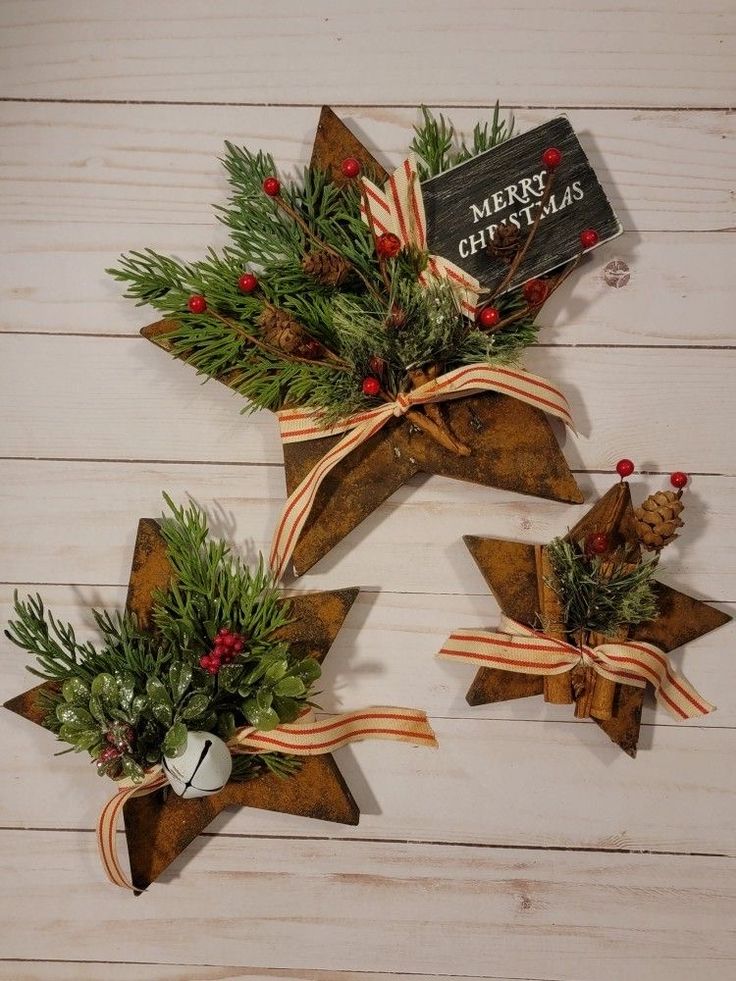 three wooden stars with christmas decorations on them