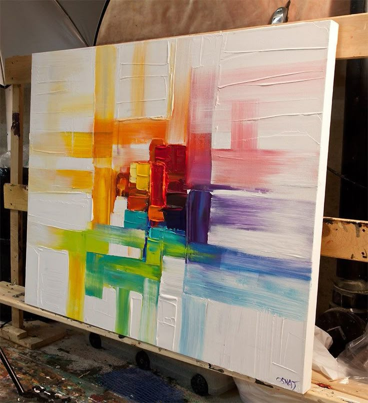 a painting is being worked on in a studio