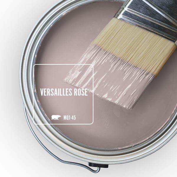 a paint can with a brush in it and the words versallies rose