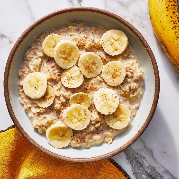 a bowl of oatmeal with bananas on top