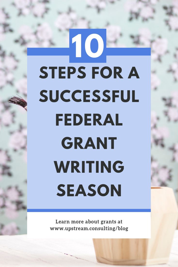 a blue sign that says 10 steps for a successful federal grant writing season with flowers in the background