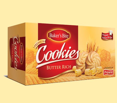 a box of cookies that is on a yellow background with the words cookies butter rich