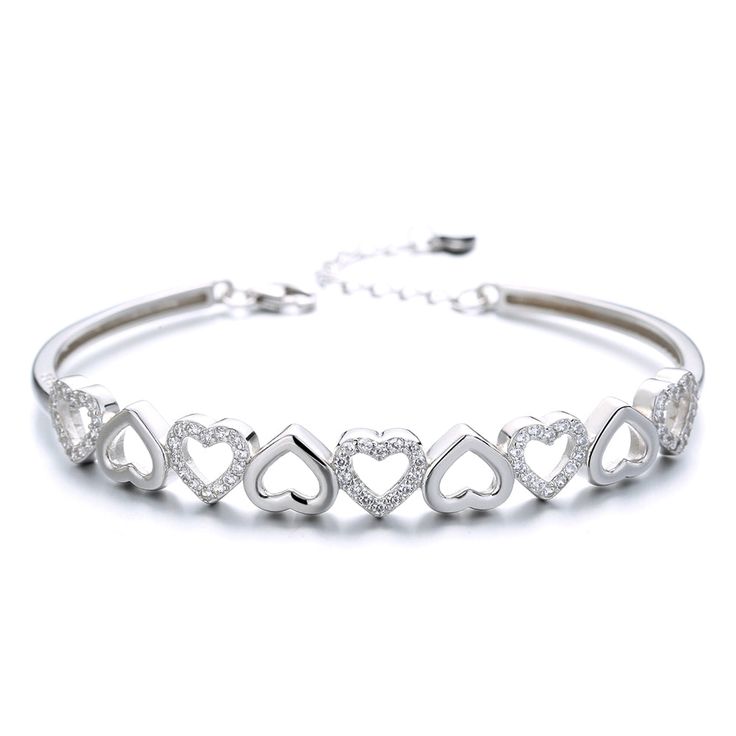 The Sterling Silver and Swarovski Crystal Hearts Bangle Adjustable Bracelet is not only beautiful and delicate but also very comfortable. With minimal design, it can be worn every day, to go out or just around the house. This accessory makes gracefulness and elegance perfect for a special occasion where you want to look good and elegant. Wear our Sterling Silver Bracelet for a unique accessory for your wardrobe! Made from high-quality materials and extra durable, this piece will last long. It's hypoallergenic, lead, and nickel free so it's safe for sensitive skin to wear. Whether you are looking for a simple accessory or something more elaborate, this Hearts Bangle bracelet will become a cherished piece within your jewelry collection. Makes a great gift for your sister, daughter, granddaug Luxury Silver Heart-shaped Bracelets, Cheap Crystal Bangle Bracelets, Cheap Crystal Bangle Bracelet, Luxury Silver Heart Bracelet, Luxury Sterling Silver Crystal Bracelet As Gift, Luxury Silver Bracelet Gift For Her, Cheap Silver Crystal Bracelets, Cheap Trendy Silver Crystal Bracelet, Cheap Silver Crystal Bracelet