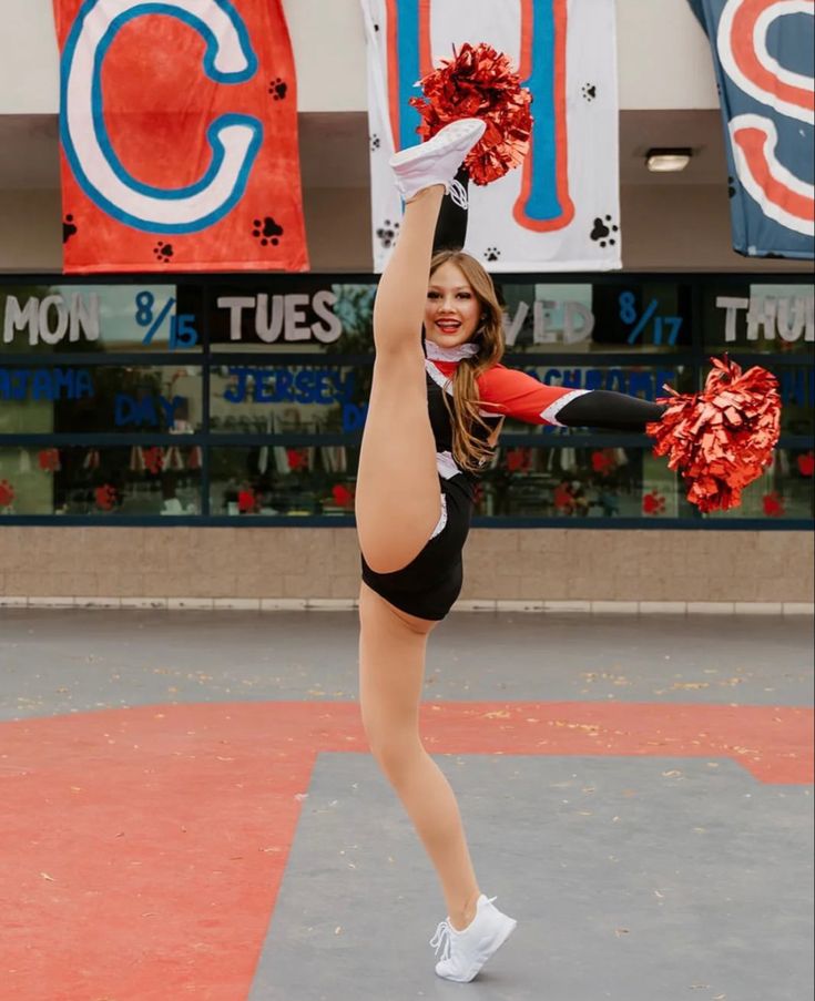 a cheerleader is doing tricks on the court