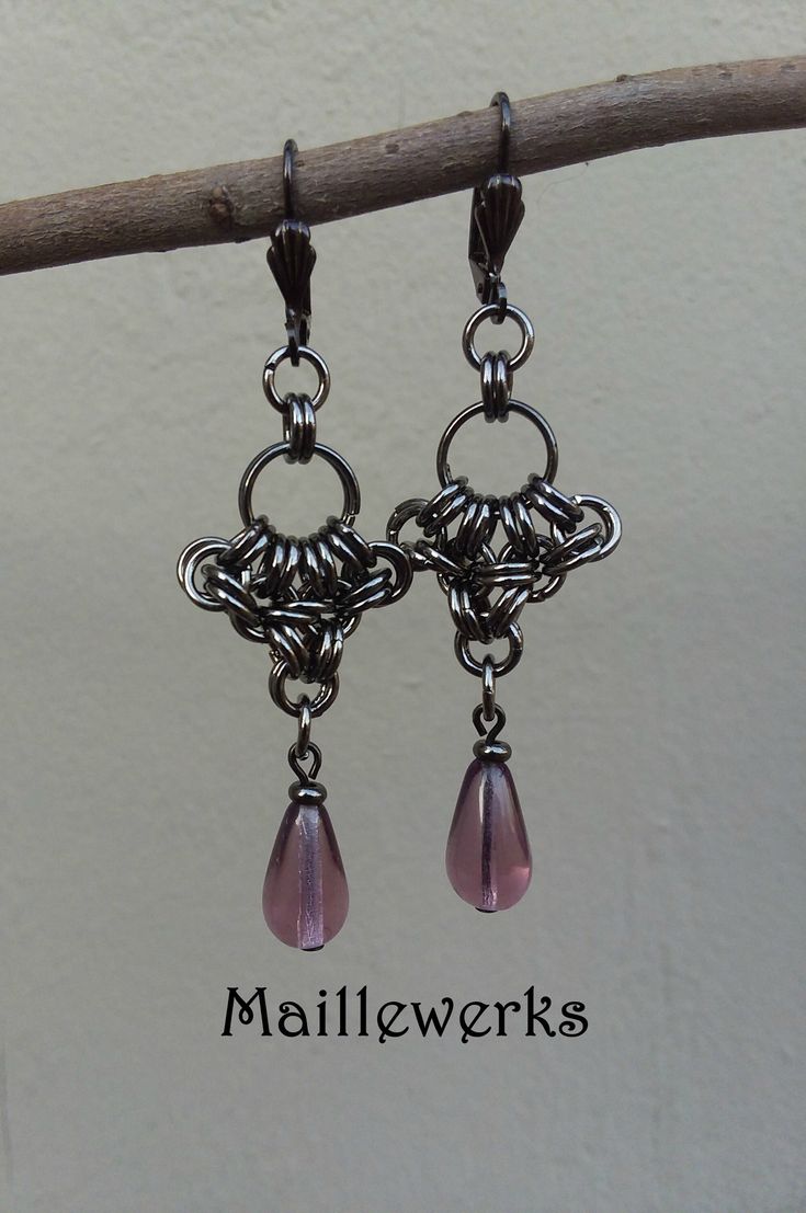 These Long and Dramatic Chainmaille Earrings are handcrafted with Amethyst Purple Glass Teardrops and more than 60 antiqued black gunmetal plated metal jump rings.  Gunmetal Lever Back Ear Wires for pierced ears.   Earring Length from top of Ear Wires to bottom 2 3/4" (7 cm) long and 3/4" (2 cm) wide. Wonderful gift for that special February born person in your life! Necklace sold separately. See matching Necklace here!: https://www.etsy.com/Maillewerks/listing/1454765426 Chainmaille has a fluid Gunmetal Jewelry, Chainmaille Earrings, Chainmaille Jewelry, Chainmail Jewelry, Chain Maille Jewelry, February Birthday, Anniversary Jewelry, Amethyst Purple, Purple Glass