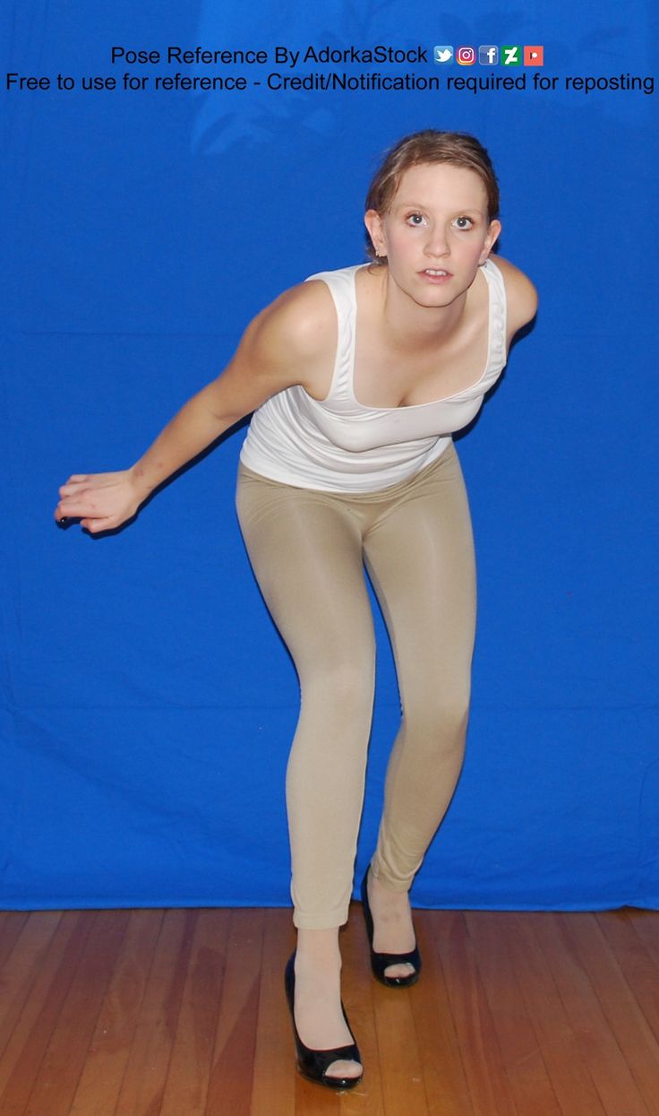 a woman in tights is posing for the camera