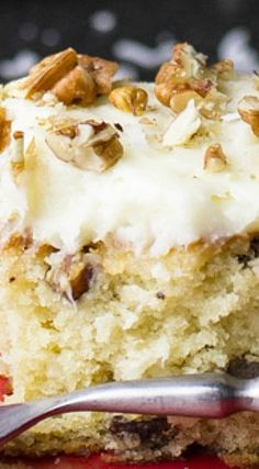 a close up of a piece of cake on a plate with a fork in it