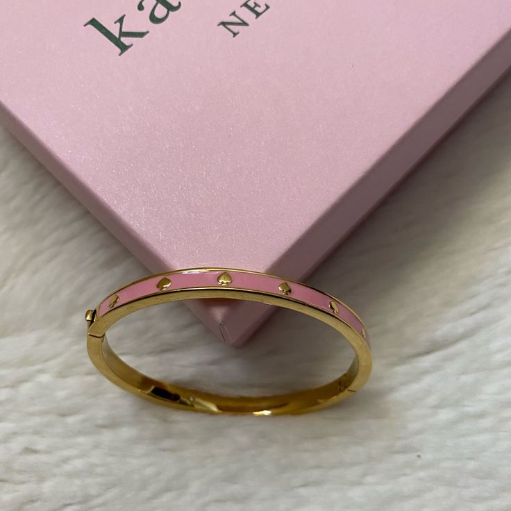 One Size Fits All; Hinge Opening 14k Gold Plated And Enamel Brand New Kate Spade Includes 1 Jewelry Bag Kate Spade Elegant Bangle Jewelry, Kate Spade Bangle Jewelry Gift, Kate Spade Gold Bracelet Jewelry, Kate Spade Bangle Jewelry For Gift, Kate Spade Pink Bracelets As Gift, Kate Spade Pink Bracelet Gift, Kate Spade Gold Bracelets, Adjustable Pink Kate Spade Bracelets, Adjustable Pink Kate Spade Bracelet