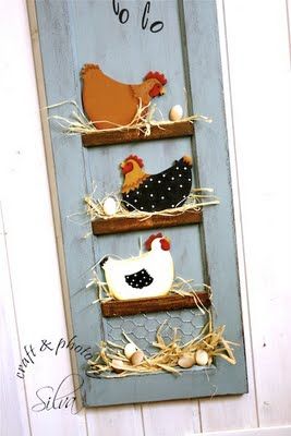 an old door is decorated with chickens and rooster figurines on the shelfs