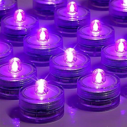 rows of purple lit candles sitting on top of each other