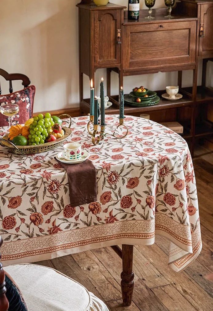 a table with fruit and candles on it