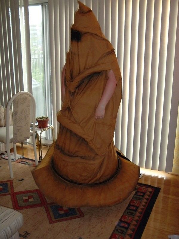 a person wrapped in a blanket standing on a rug