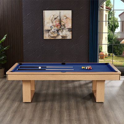 a pool table in the middle of a living room