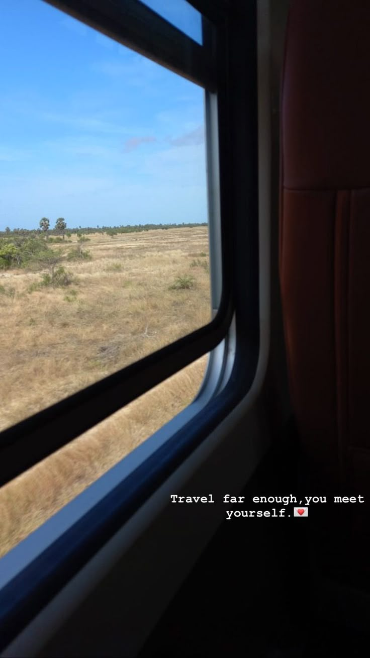 an airplane window looking out on the plains