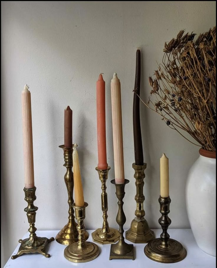 five candles are lined up next to each other