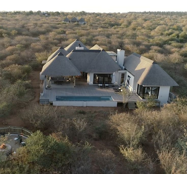 an aerial view of a house in the middle of nowhere