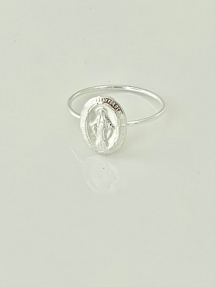 Sterling Silver Virgin Mary Oval Ring Virgin Mary Coin 14x9 mm Skinny band ring Please leave a note -size of Ring at checkout Sizes available 5,6 ,7 ,8 or 9 Priced per piece When you checkout, please state how size you need.6,7 and 8 are available at this time. Virgin Mary Ring, Catholic Jewelry, Oval Ring, Oval Rings, Sterling Silver Hoops, Stacking Ring, Pretty Jewellery, Virgin Mary, Easter Gift