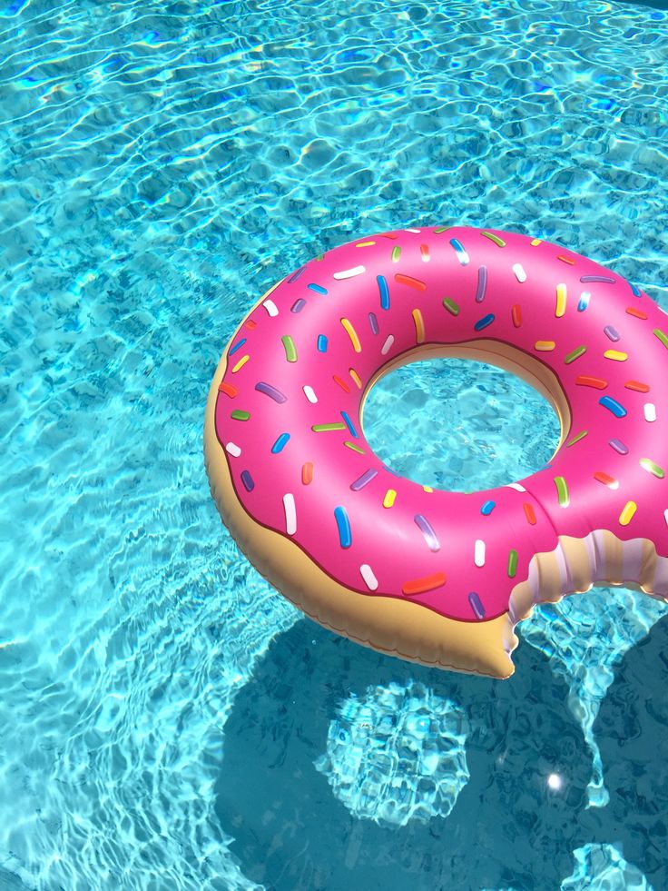 an inflatable donut floating on top of a swimming pool