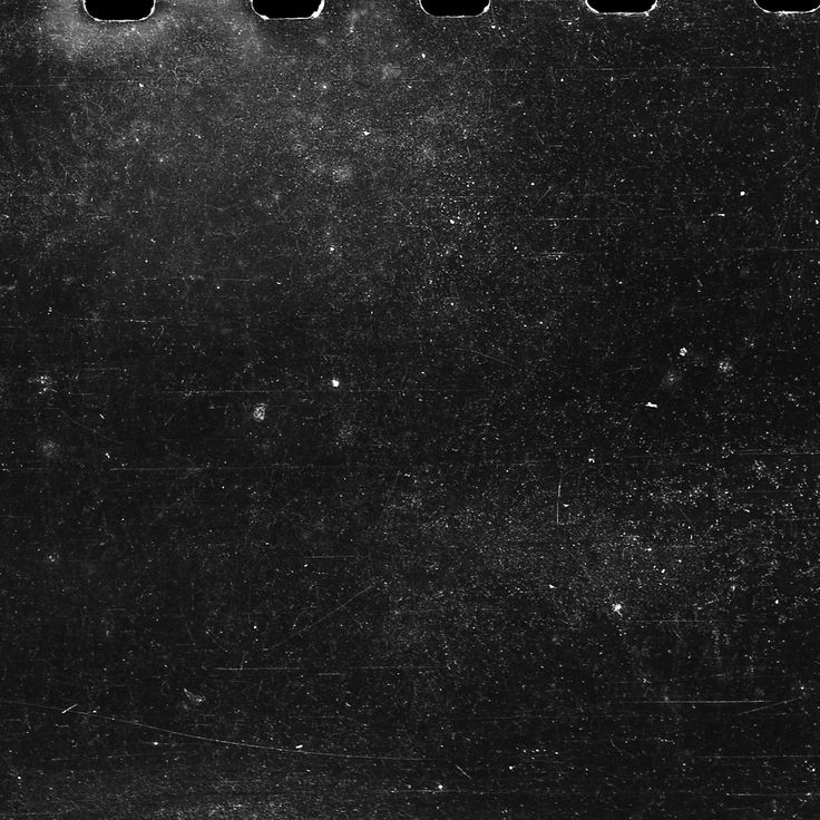 an old black and white photo with holes in it