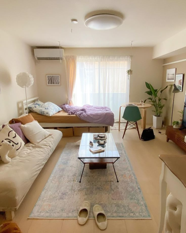 a living room filled with furniture and a flat screen tv