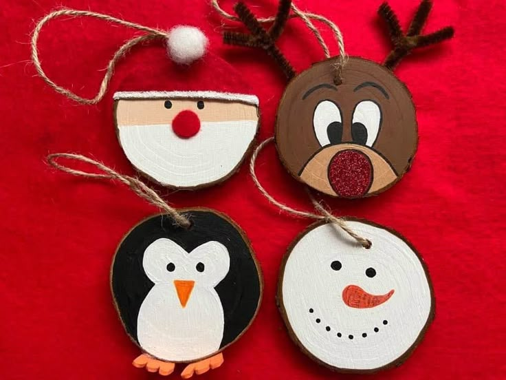 christmas ornaments made out of wood and painted to look like animals