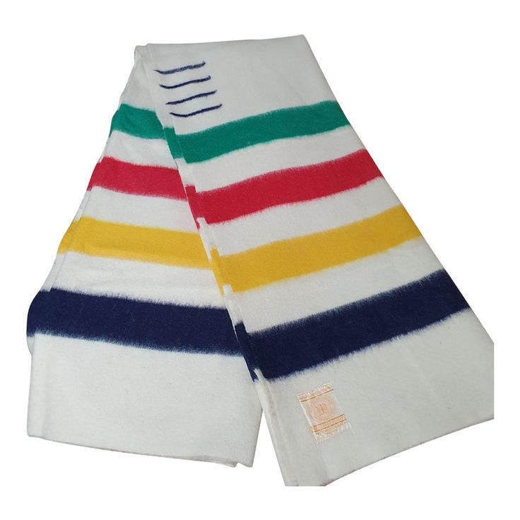 two white towels with multi - colored stripes are folded on top of each other,