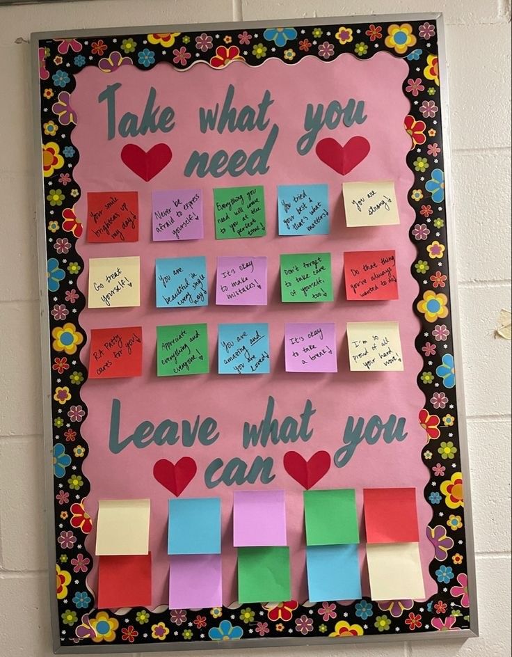 a bulletin board with post - it notes and hearts on it that says, take what you need leave what you can