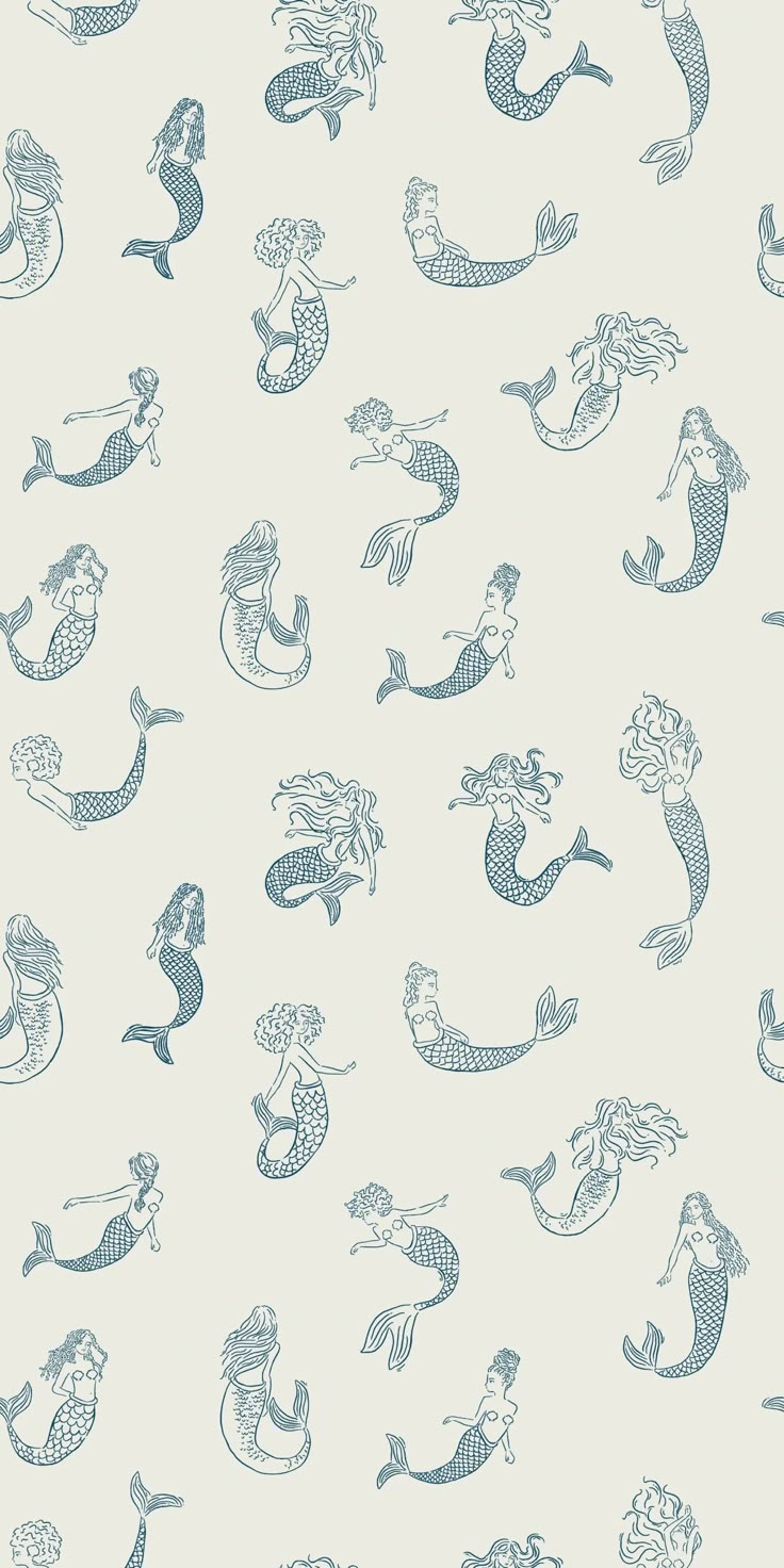 a blue and white wallpaper with various mermaids on the back ground, all in different sizes