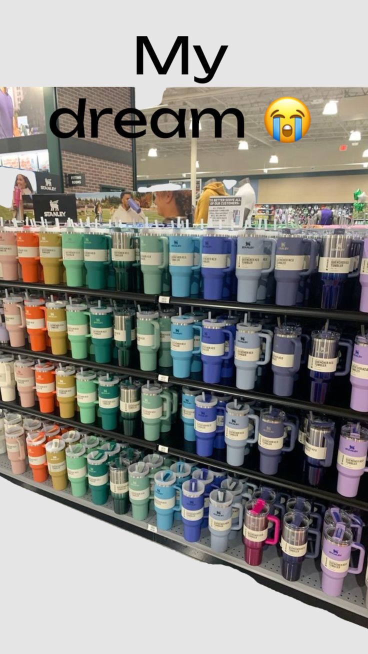 there are many cups on display in the store