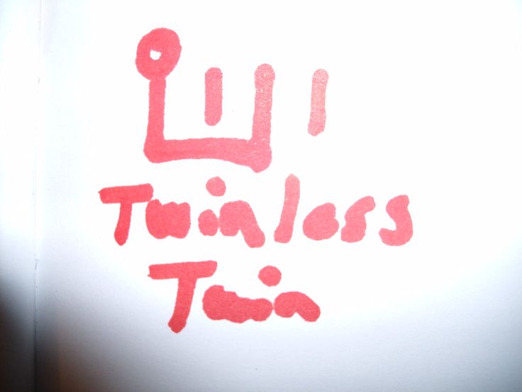 there is a red ink that says luj trizzles tim on the wall