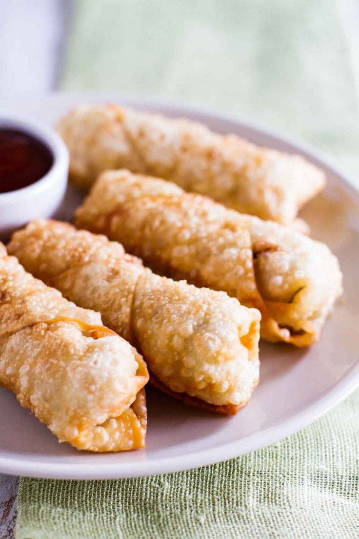 some fried food on a plate with dipping sauce