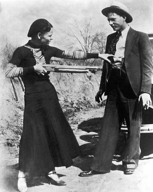 an old black and white photo of two people standing next to each other with the caption bonnie & clyde