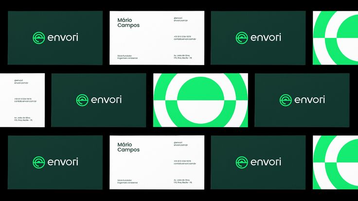 several business cards with green and white logos on them, all in different shapes and sizes