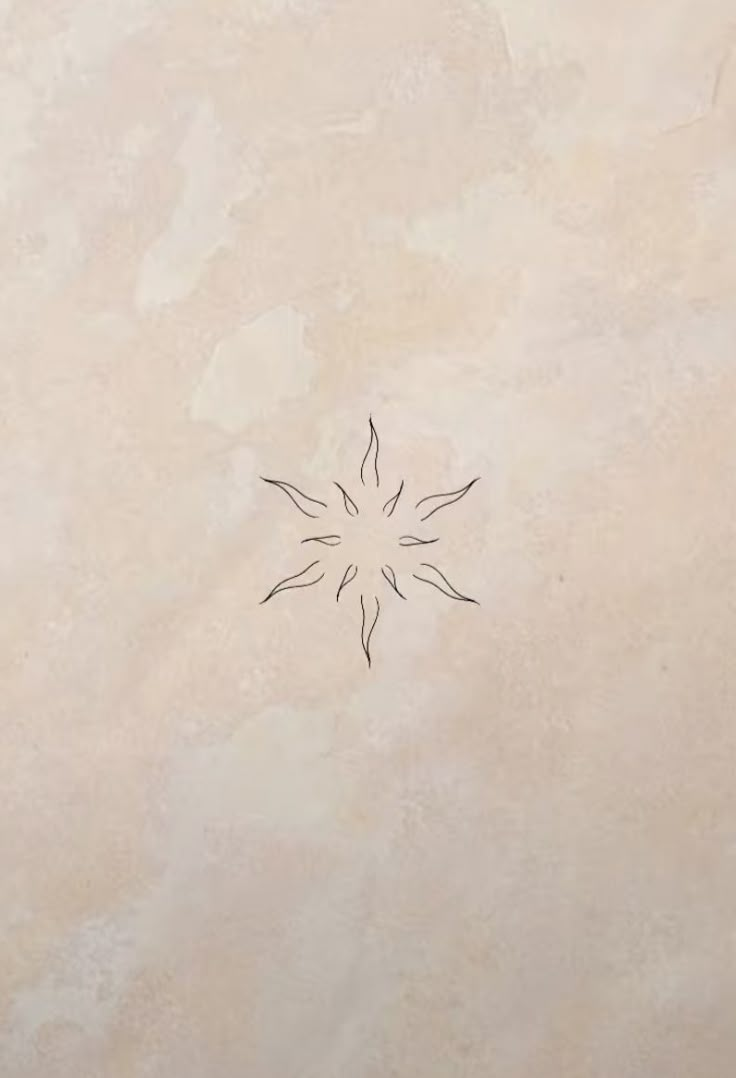 a drawing of a flower on the side of a wall with no one in it