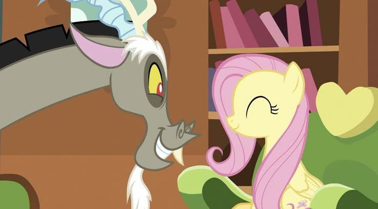 the pinkie pony is talking to her friend in front of a bookshelf