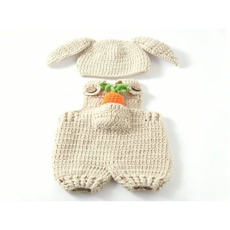 a knitted bunny outfit with carrots on the chest and ears attached to it