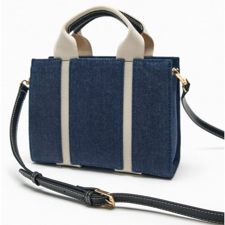 Zara Nwt Denim Fabric Mini City Bag Denim Blue Fabric Mini City Bag. Handles And Removable Crossbody Shoulder Strap. Zip Closure. Height X Length X Width: 9.3” X 11.3” X 5.1” Outer Shell Fabric Main Fabric: 100% Cotton Strap: 80% Polyester 20% Polyurethane Shoulder Strap: 100% Polyurethane Lining: 100% Cotton Imported Bundle And Save Denim Bags With Adjustable Strap And Double Handle, Denim Double Handle Bag With Adjustable Strap, Denim Shoulder Bag With Double Handle, Casual Denim Rectangular Satchel, Denim Crossbody Shopping Bag, Denim Crossbody Bag For Shopping, Rectangular Denim Bags With Adjustable Strap, Denim Blue Canvas Crossbody Bag, Daily Use Denim Crossbody Bag