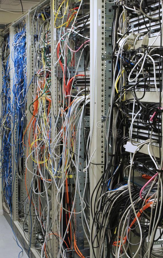 many wires are tangled up in the server room, and there is no image here to provide a caption for