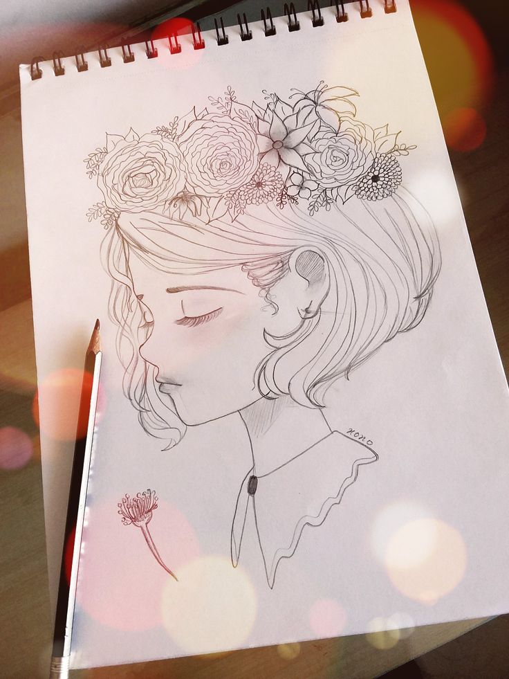 a drawing of a girl with flowers in her hair