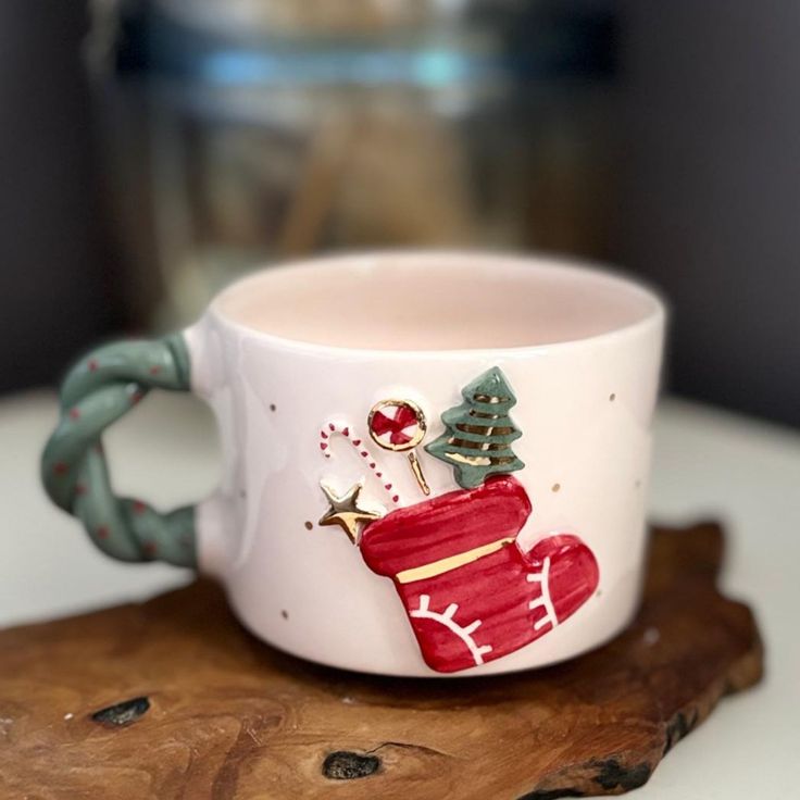 a coffee cup decorated with christmas decorations