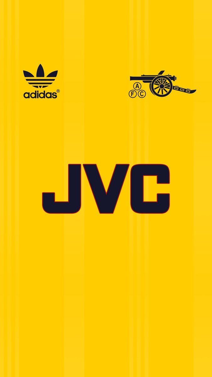 the jvc logo is shown on a yellow background with black and white stripes around it