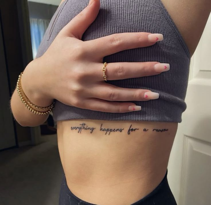 a woman's stomach with the words everything happens for a reason written on it