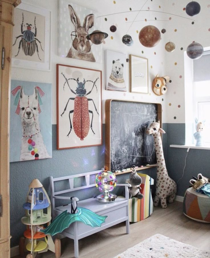 a child's room with pictures and toys on the wall