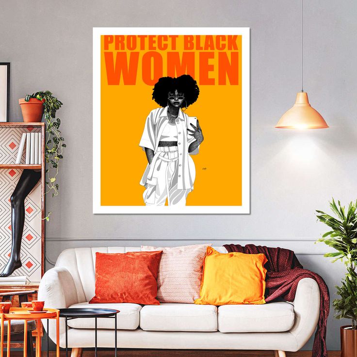 a living room filled with furniture and a poster on the wall above it that says protect black women